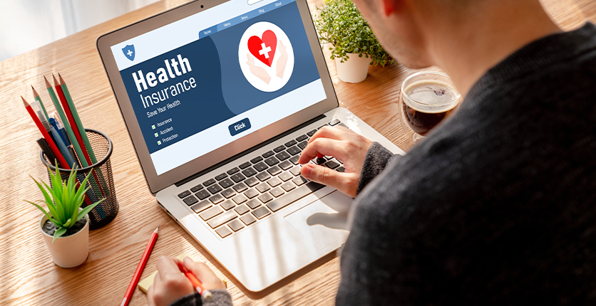 Young man browsing an insurance website