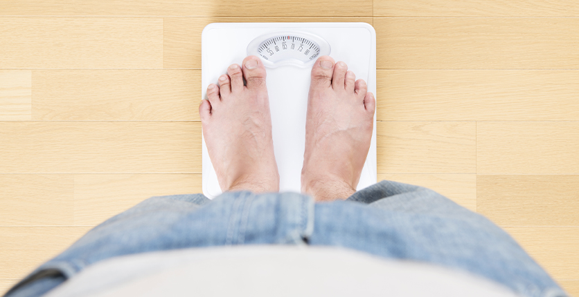 A pair of feet on a weighing scale