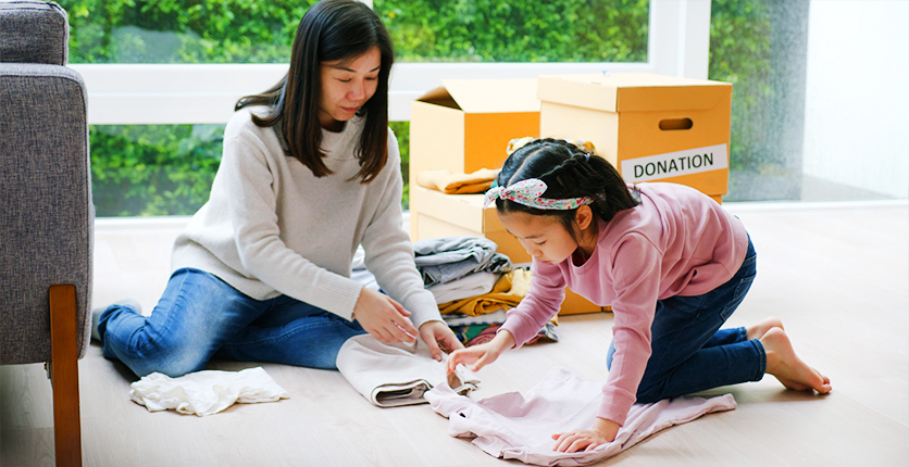 Mother and daughter doing volunteer work together