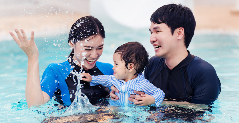 Young family in swimming pool