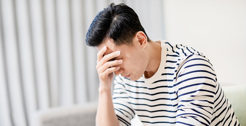 Man putting his head in his hands