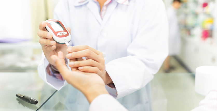 Person getting a finger prick blood sugar test