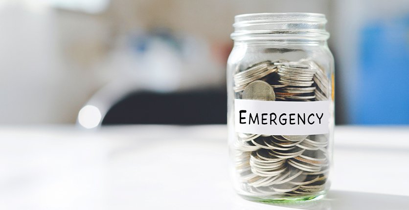 Jar of coins labelled "Emergency"