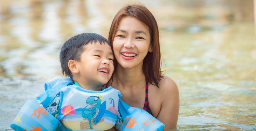 woman and kid in swimming pool