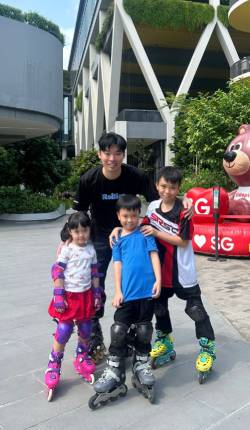 Ernest Wong with skate students 2